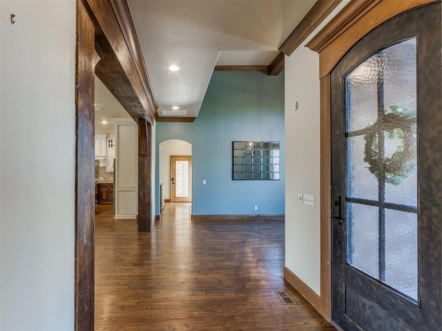 entryway with dark hardwood / wood-style flooring