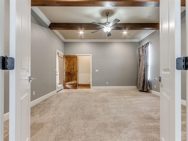 unfurnished bedroom with beam ceiling and light carpet