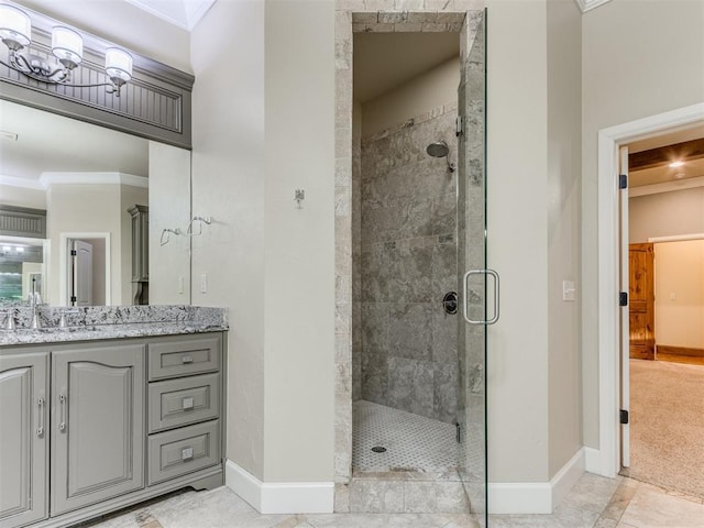 bathroom featuring crown molding, vanity, and an enclosed shower