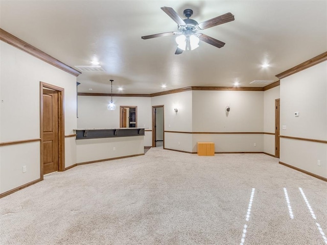 interior space with crown molding, light carpet, and ceiling fan