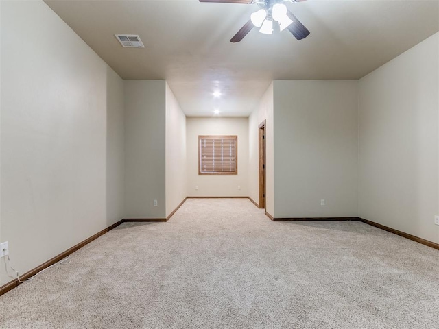 carpeted empty room with ceiling fan