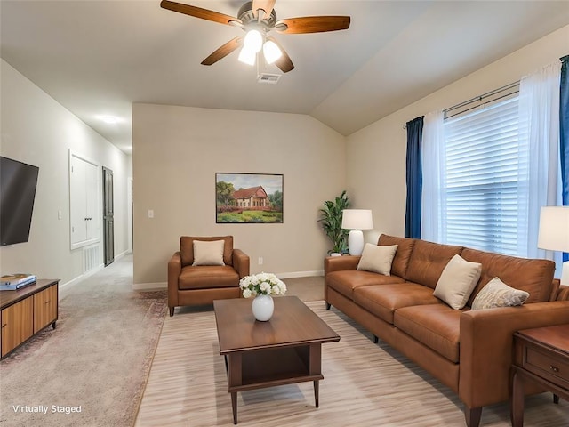 carpeted living room featuring vaulted ceiling and ceiling fan