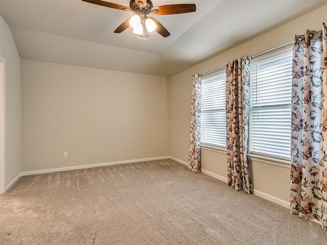 unfurnished room featuring light colored carpet and ceiling fan