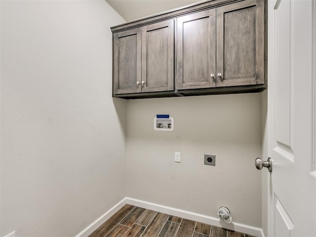 laundry room with washer hookup, cabinets, and hookup for an electric dryer