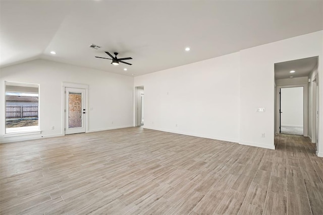 unfurnished living room featuring vaulted ceiling and ceiling fan