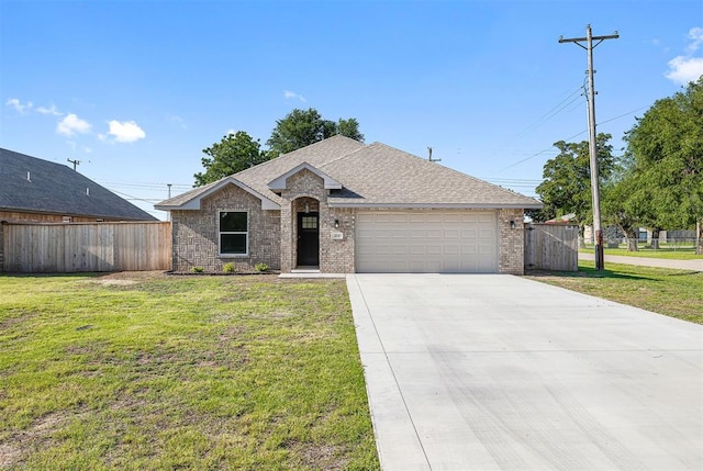 202 E Main St, Calumet, OK 73014 - view of front facade with an attached garage, brick siding, roof with shingles, and concrete driveway