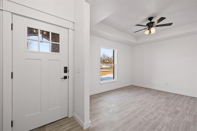 202 E Main St, Calumet, OK 73014 - entryway with healthy amount of natural light, a raised ceiling, baseboards, and light wood-style flooring