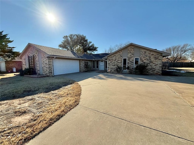 ranch-style house featuring a garage