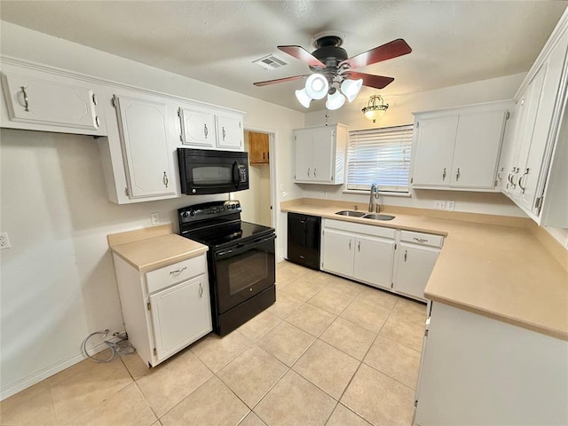 kitchen with white cabinetry, sink, and black appliances