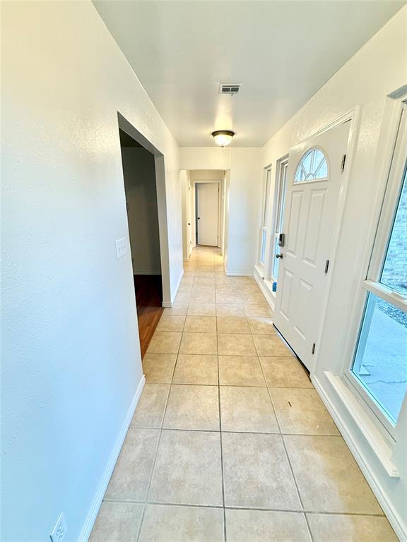 interior space featuring light tile patterned floors