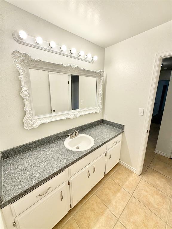 bathroom featuring tile patterned floors and vanity