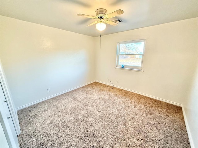 empty room featuring carpet and ceiling fan