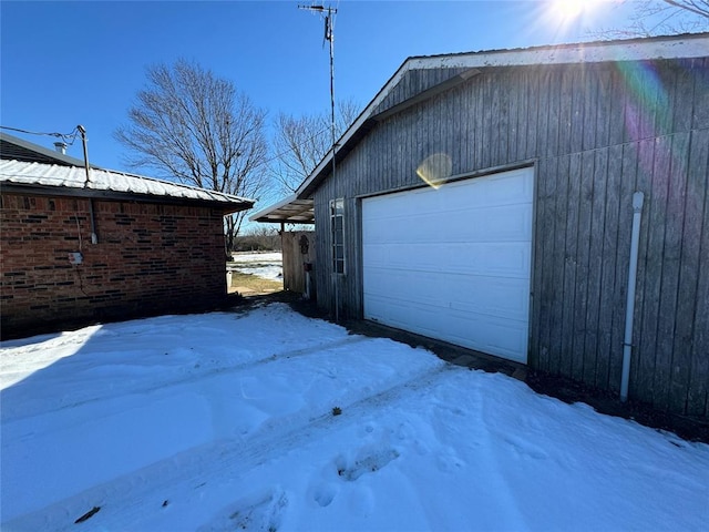 view of snow covered garage