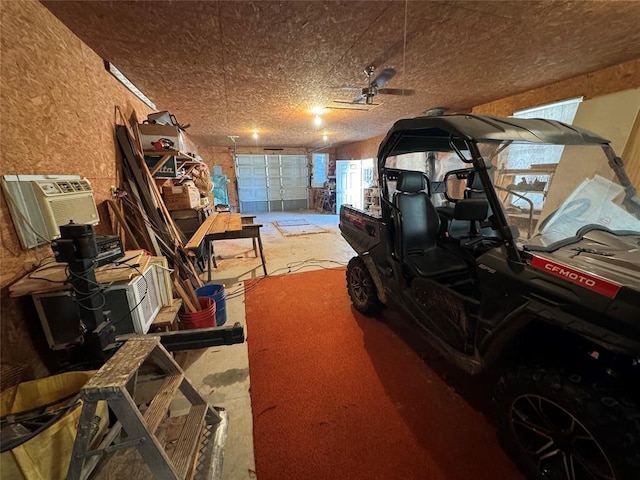 garage featuring a wall unit AC