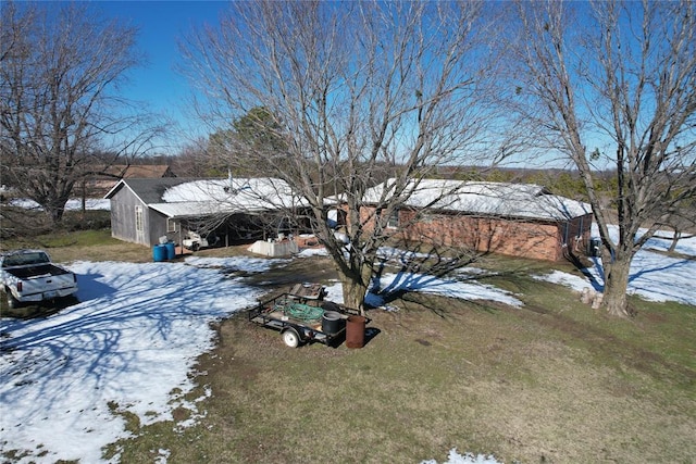 view of front of home featuring metal roof and a yard