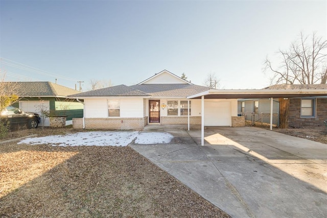 single story home featuring a carport and a garage