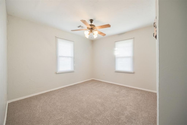 carpeted empty room with ceiling fan