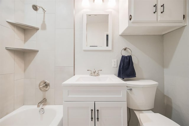 full bathroom with toilet, tiled shower / bath, and vanity