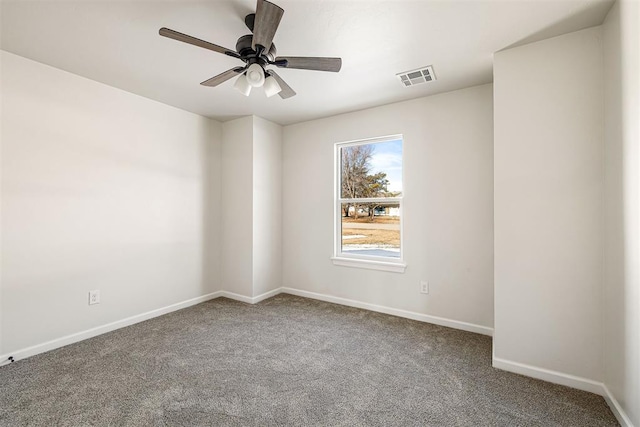 carpeted empty room featuring ceiling fan