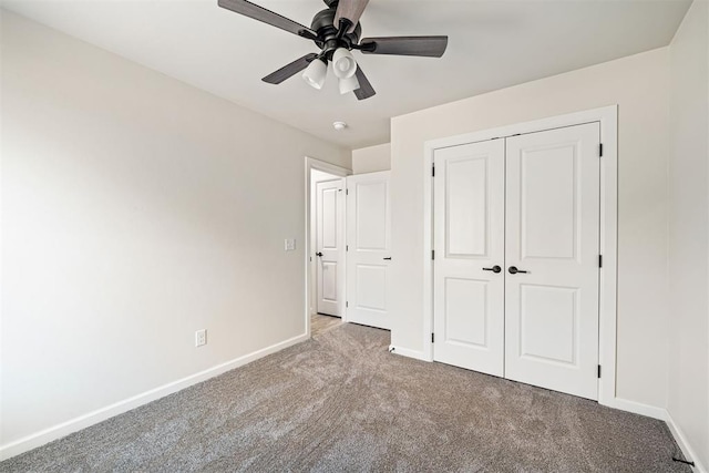 unfurnished bedroom featuring ceiling fan, light carpet, and a closet