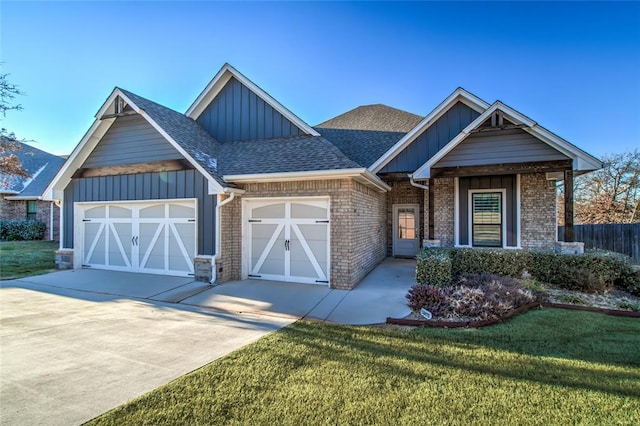 view of front facade featuring a garage and a front lawn