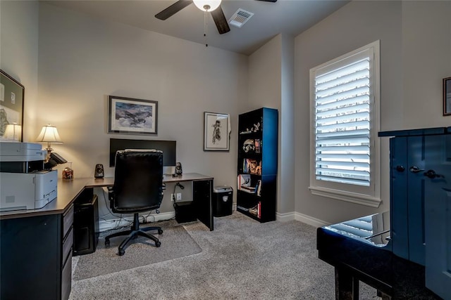 office featuring ceiling fan and light carpet