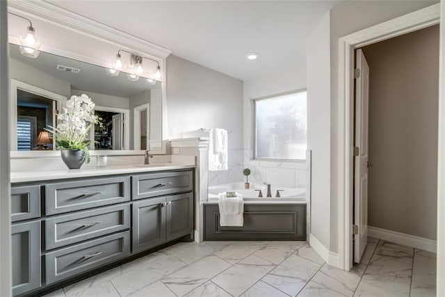 bathroom with vanity and a bathtub