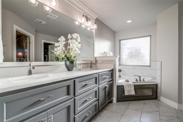 bathroom with vanity and a bathing tub