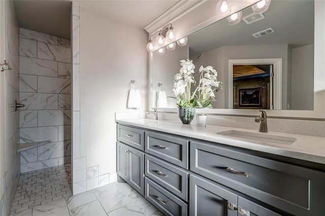 bathroom with vanity and a tile shower