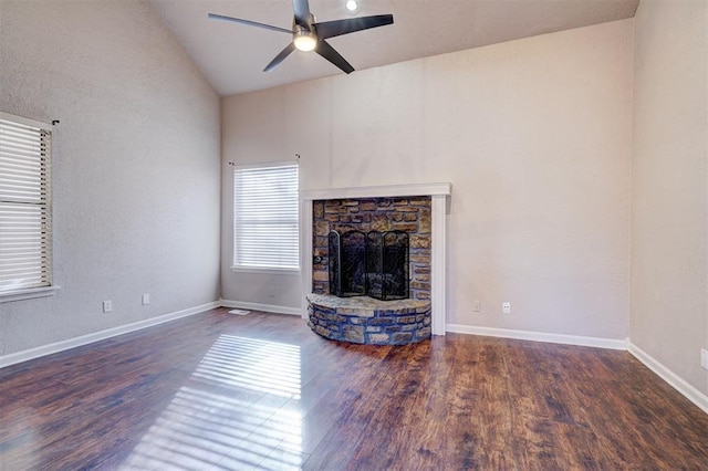 unfurnished living room featuring a fireplace, high vaulted ceiling, ceiling fan, and dark hardwood / wood-style floors