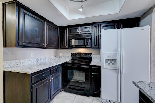 kitchen featuring black appliances, track lighting, light stone countertops, and light tile patterned floors