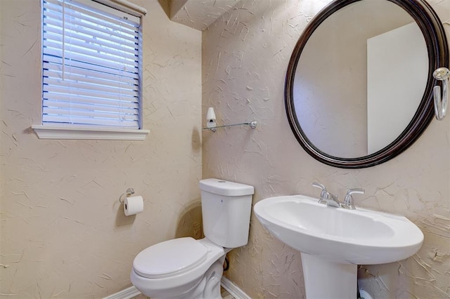 bathroom with toilet and sink