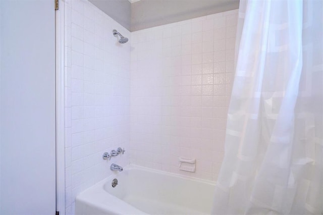 bathroom with shower / bath combination with curtain