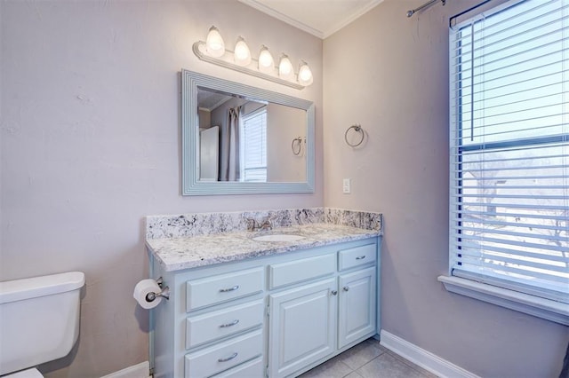 bathroom with ornamental molding, vanity, tile patterned floors, and plenty of natural light