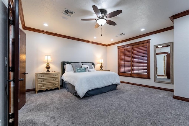 carpeted bedroom featuring ceiling fan and crown molding