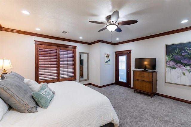 carpeted bedroom with ceiling fan and crown molding