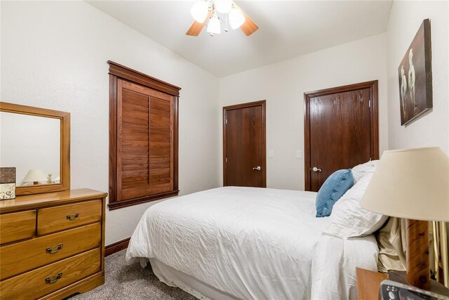 carpeted bedroom with ceiling fan