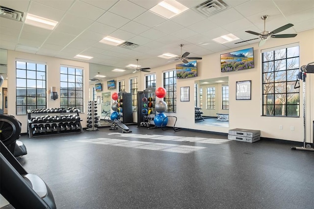 workout area with a paneled ceiling