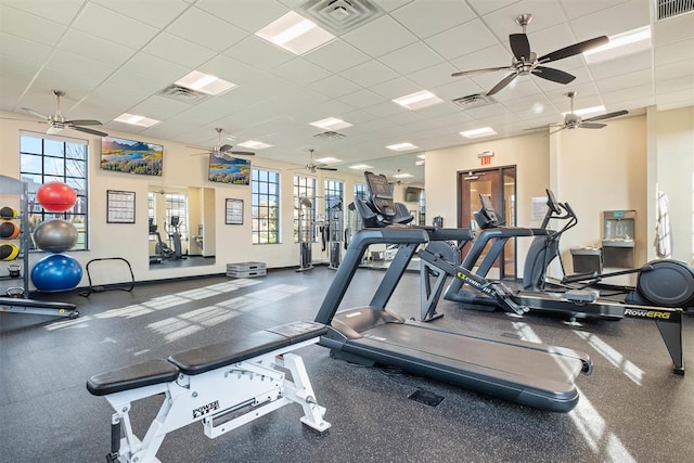 gym featuring a drop ceiling