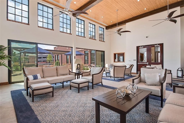 living room with wooden ceiling and a high ceiling