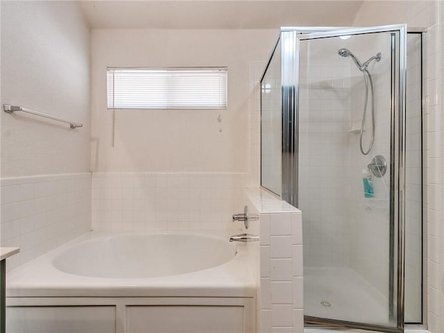 bathroom featuring plus walk in shower