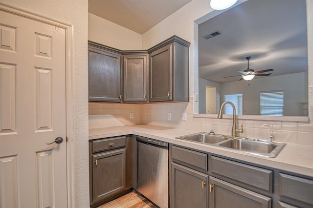 kitchen with ceiling fan, dishwasher, sink, light hardwood / wood-style flooring, and backsplash