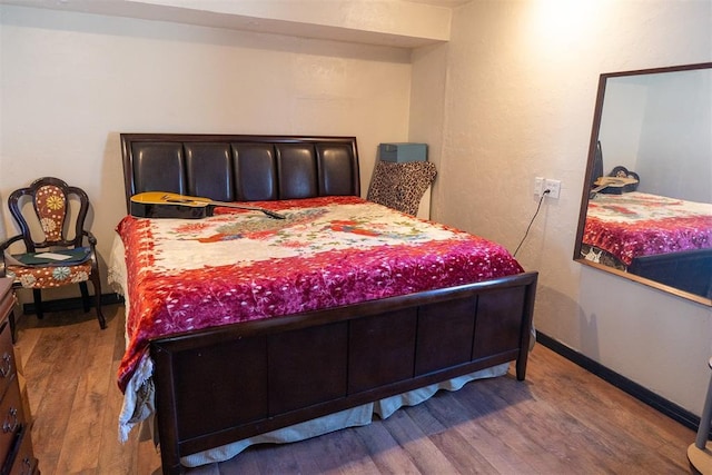 bedroom featuring hardwood / wood-style floors