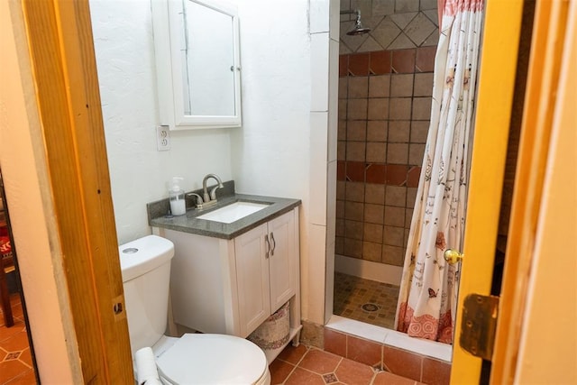 bathroom with vanity, a shower with curtain, tile patterned floors, and toilet