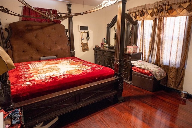 bedroom featuring dark hardwood / wood-style flooring