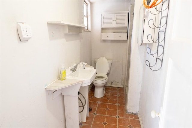 bathroom with tile patterned floors and toilet