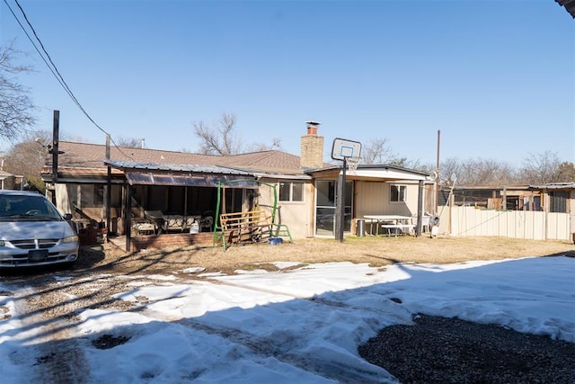 1316 Hillcrest Rd, Pauls Valley, OK 73075 - rear view of house featuring a sunroom and a chimney
