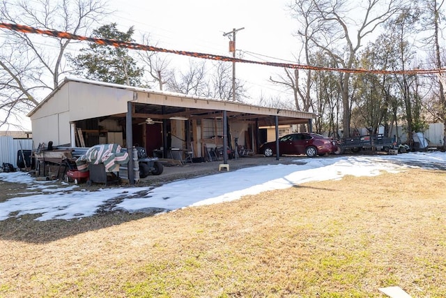 1316 Hillcrest Rd, Pauls Valley, OK 73075 - snow covered structure with an outbuilding, a lawn, and a carport