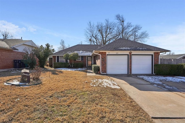 ranch-style home featuring a garage