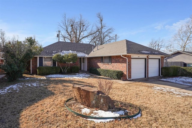 ranch-style home featuring a garage